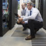Computer technician in server room